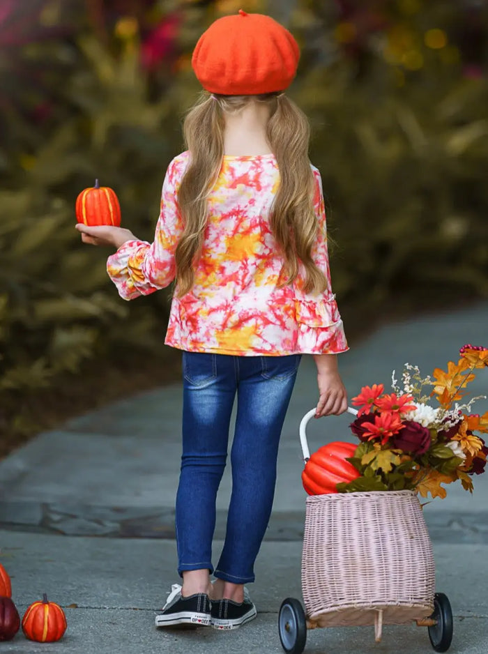 Little girls long-sleeve tie-dye top with double ruffle cuffs, "Candy Corn Cutie" graphic print, fabric-patched jeans, and a matching tie-dye sash belt - Mia Belle Girls