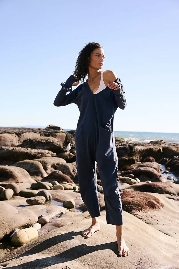 Woman wearing Free People Hot Shot Long Sleeve One Midnight Navy on rocky shoreline