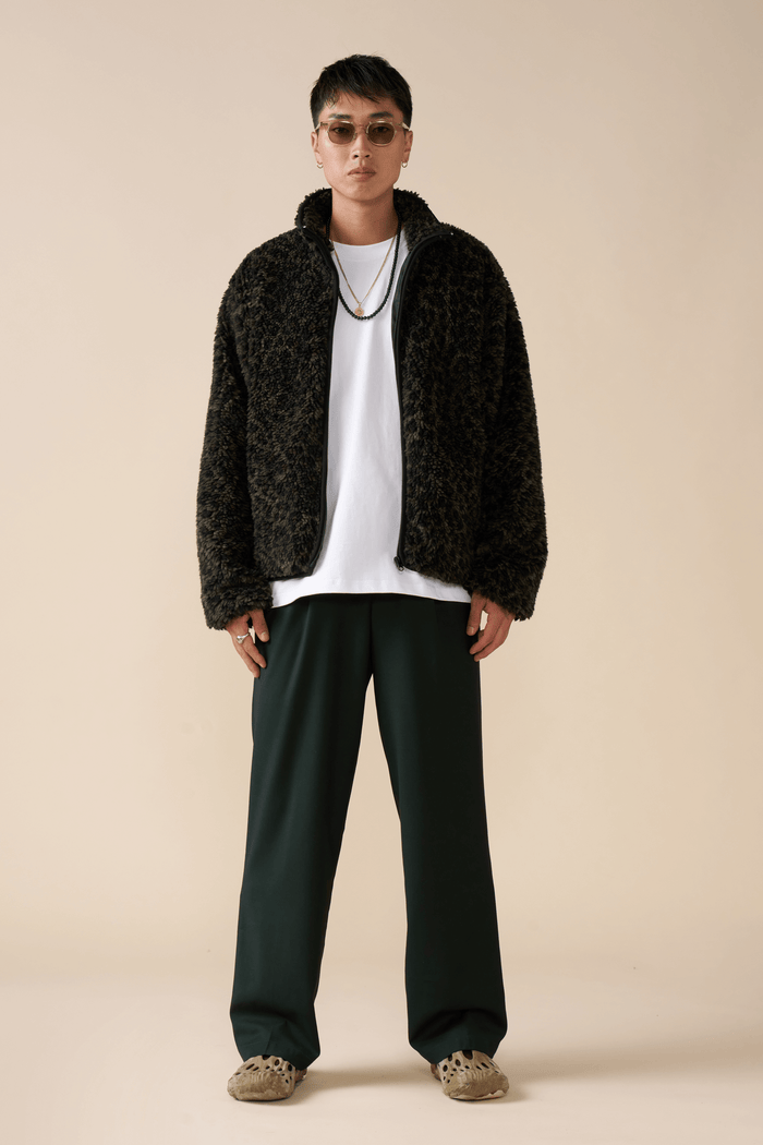 Model wearing Éclectique leopard fleece jacket
