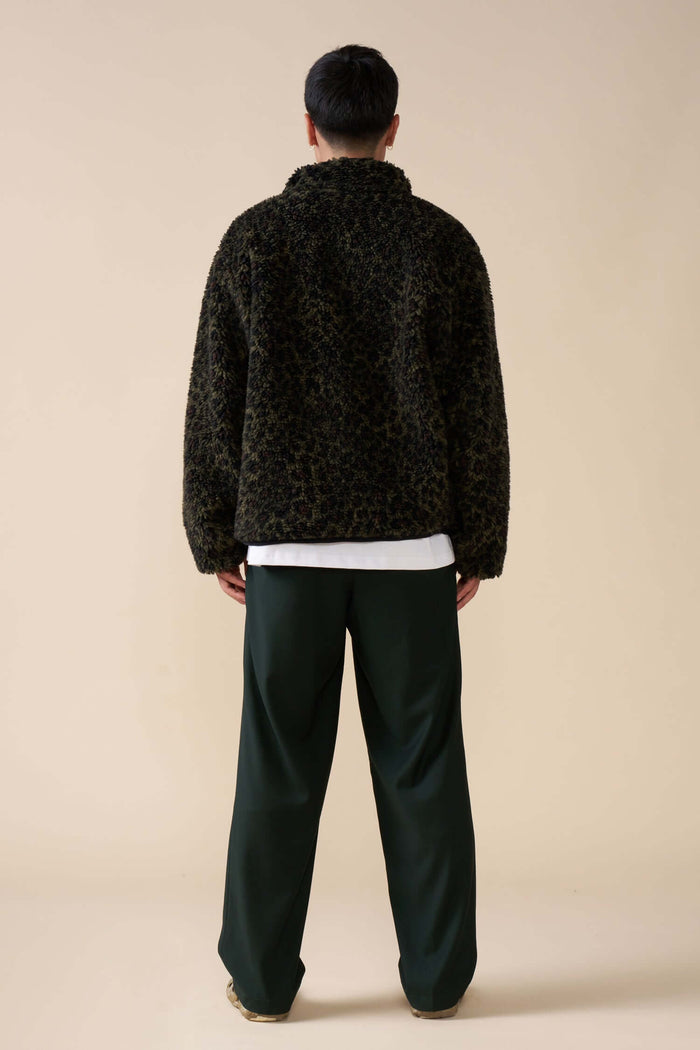 Back view of Éclectique leopard fleece jacket on model