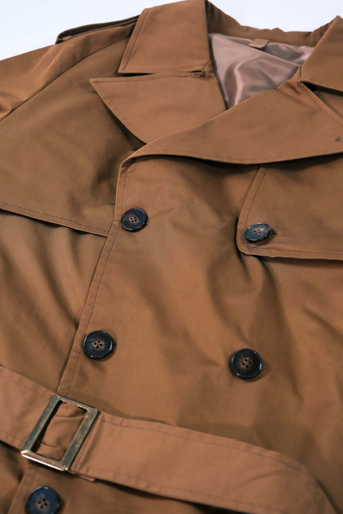 Men’s Camel Trench Coat featuring a double-breasted design and belted waist, showcasing smooth camel fabric.