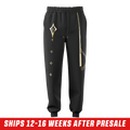 Black sweatpants with gold geometric lines on one leg and a gold emblem on the back pocket in 3XL size.