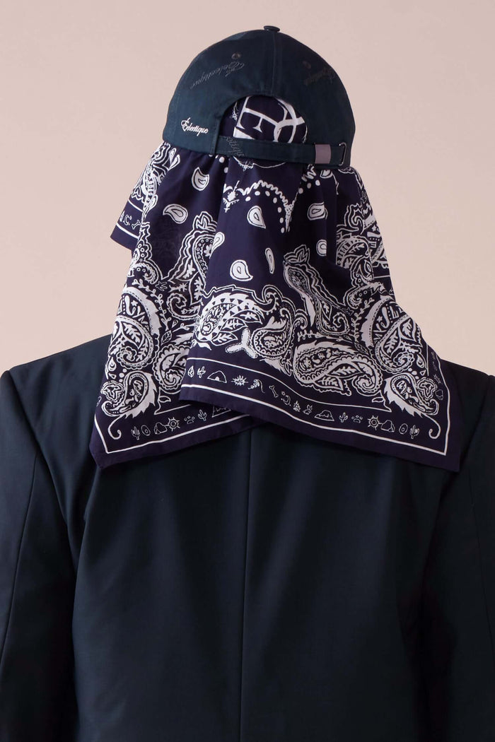 styled view of purple paisley bandana worn with hat