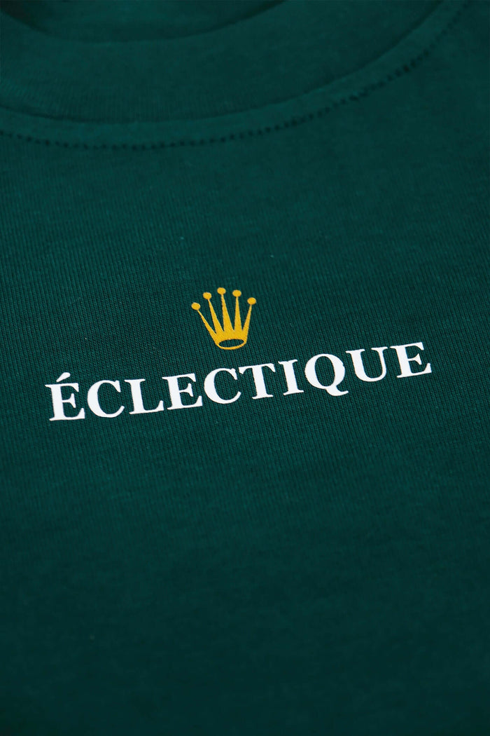 Rolex graphic T-shirt close-up of gold crown and Éclectique lettering