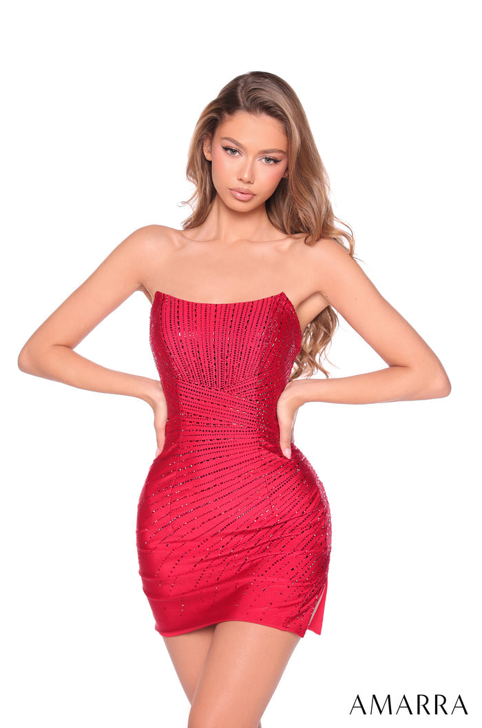 A model wears a strapless, form-fitting red dress with sparkling rhinestone details, posing against a white background.