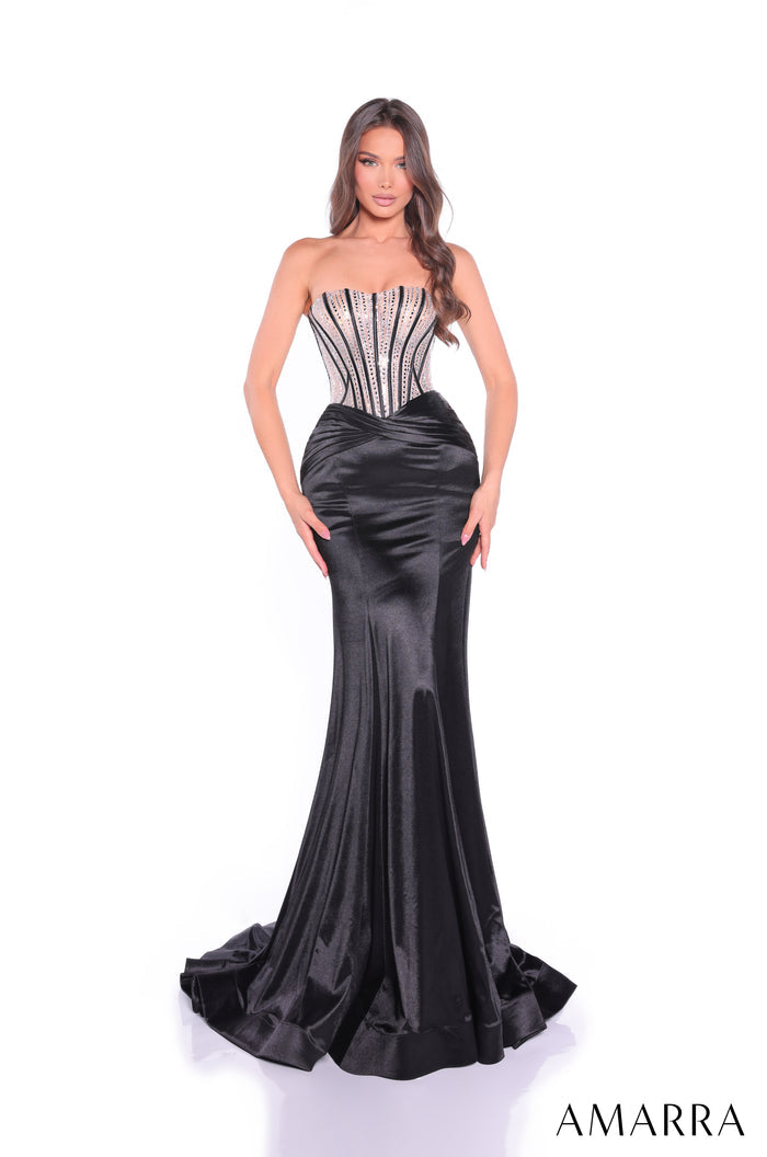 Model wears a strapless black satin gown with beaded corset bodice and dramatic mermaid-style train.