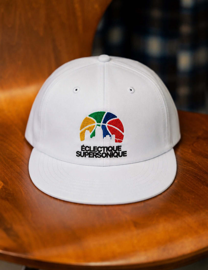 Super Sonique baseball cap with colorful embroidery on a white cotton body.