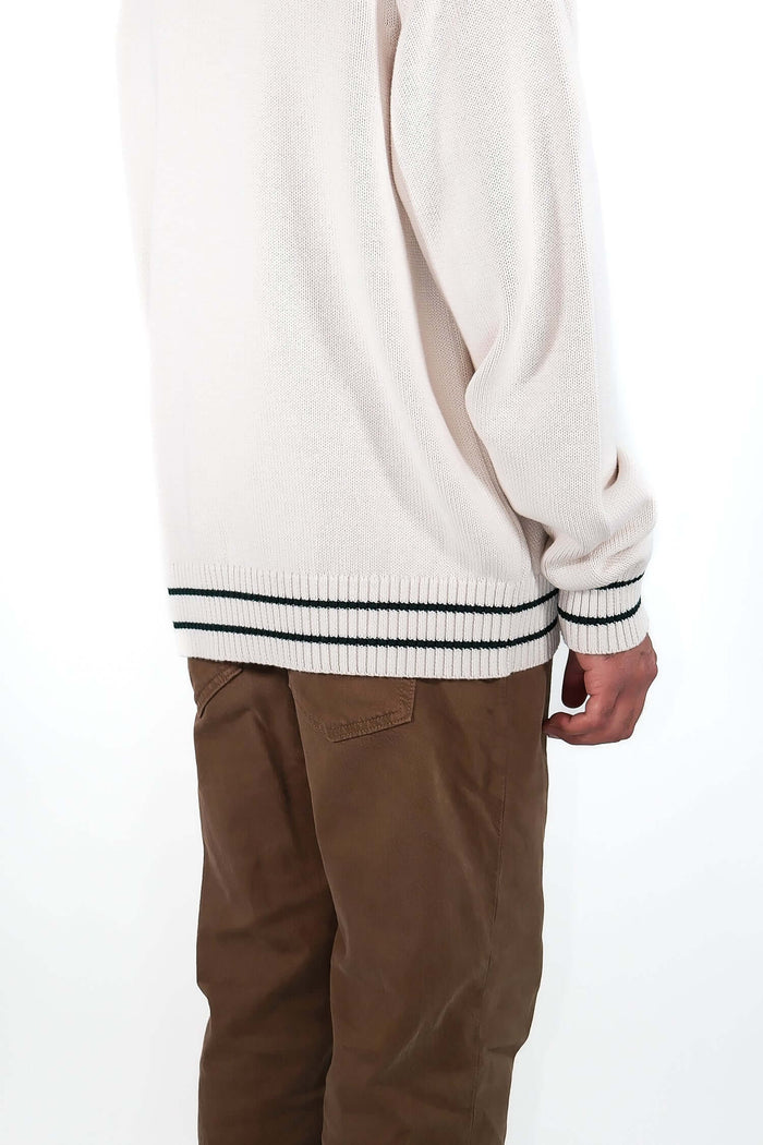 Back view of white v neck cardigan in Vanilla Ice with striped hem