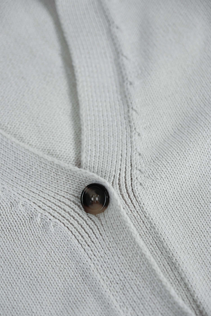 White v neck cardigan Vanilla Ice button and knit detail close-up